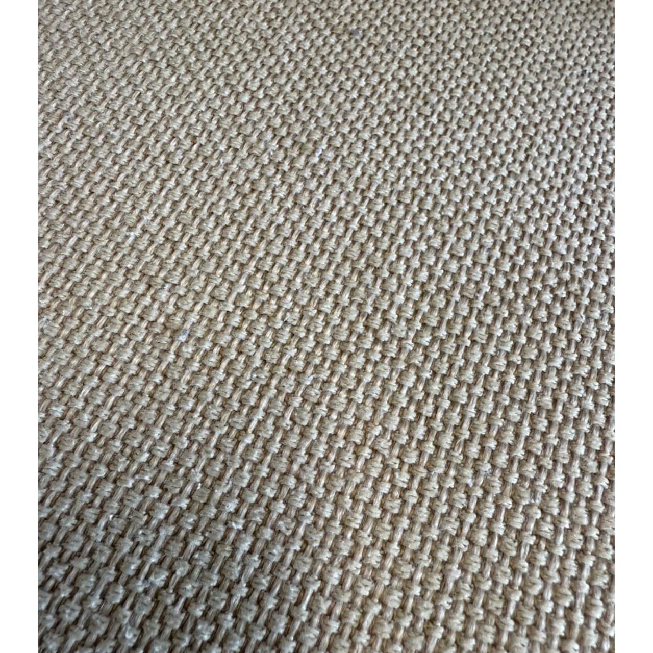 Close-up of a textured beige fabric surface
